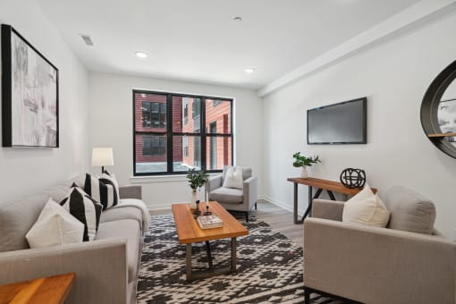 Living room with white walls and a large window  at The Anchorage on Kelly, East Falls, PA