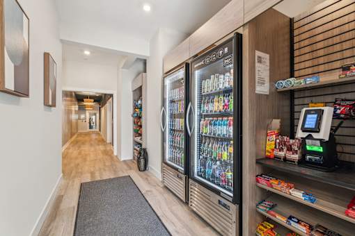 A modern vending machine with a variety of drinks and snacks.