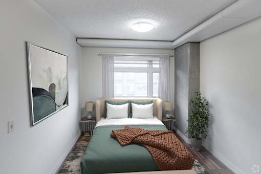 A bedroom with a bed, two lamps, a plant, and a painting on the wall.