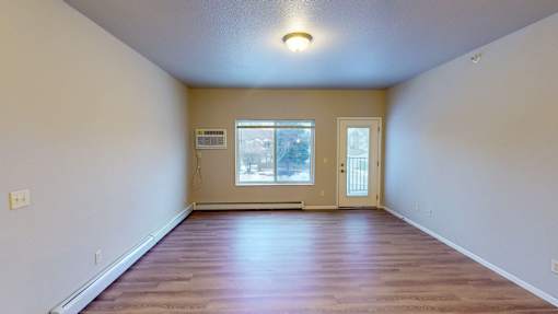 A room with a window and a door.