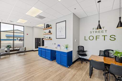 A room with a blue cabinet and a sign that says "First Street Lofts".