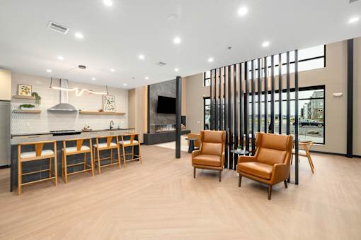 A modern kitchen with wooden floors and furniture.