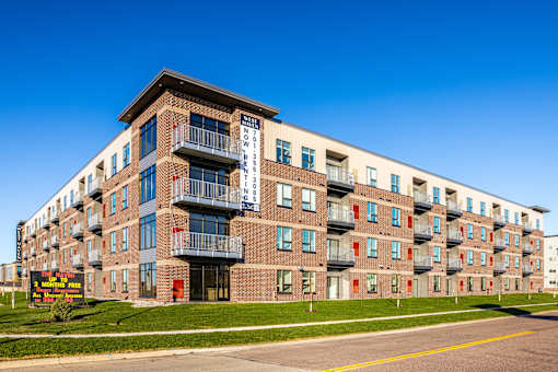 A large apartment building with a sign that says "BROOKLYN".