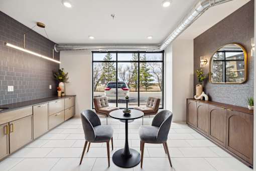A lounge area with table and chairs.