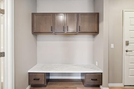 A boot bench with cabinets above.