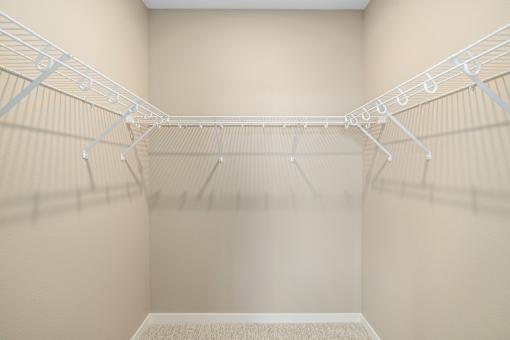 Empty white shelves in a room.