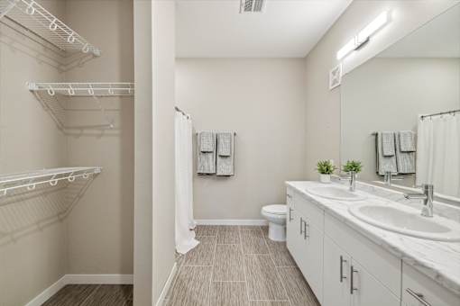 a bathroom with a sink and a shower and a toilet