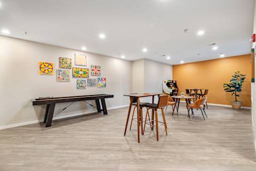 a dining room with a table and chairs and a pool table