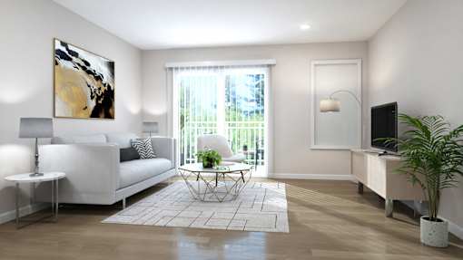A living room with a white couch, a painting on the wall, and a potted plant.