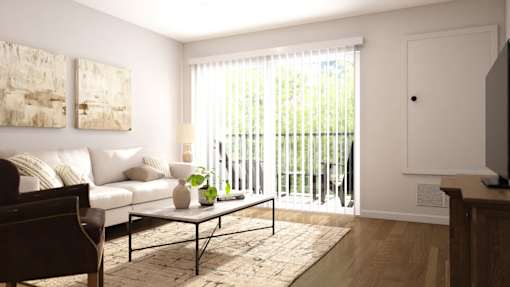 A living room with a white couch, a coffee table, and a painting on the wall.