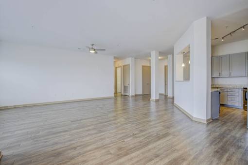 A room with wooden floors and white walls.