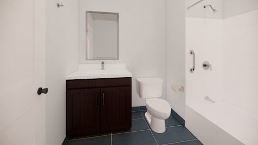 A white toilet sits in a bathroom with a white sink and a mirror.