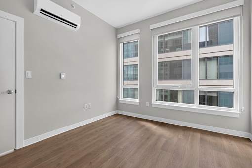 A room with a window and a door.