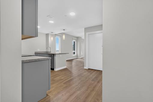 Entry in apartment interior shows interesting open floor plan.