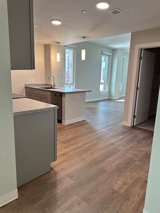 A kitchen with a countertop and a sink.