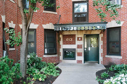 Brick building entry with landscaping