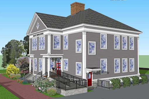 A house with a red door and a brick pathway leading to it.