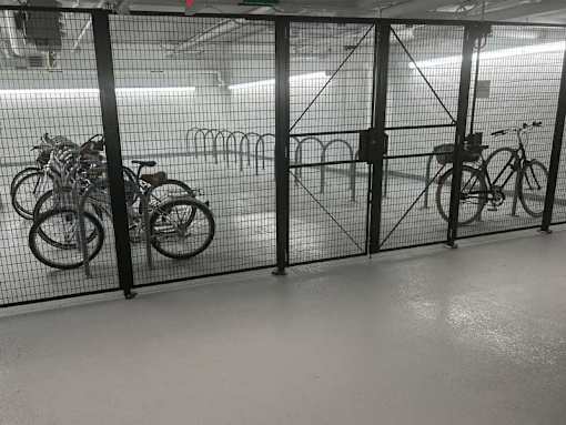 A bicycle is parked in a bike rack.