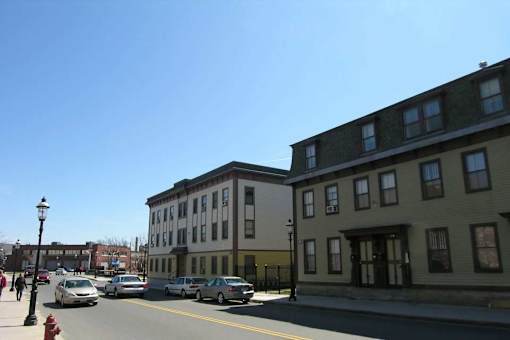 A street view with cars and buildings.