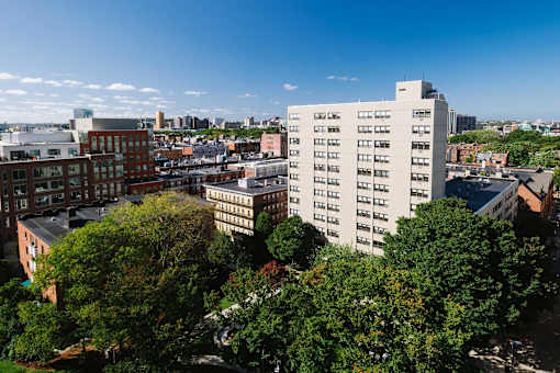 A cityscape with a large white building in the center.