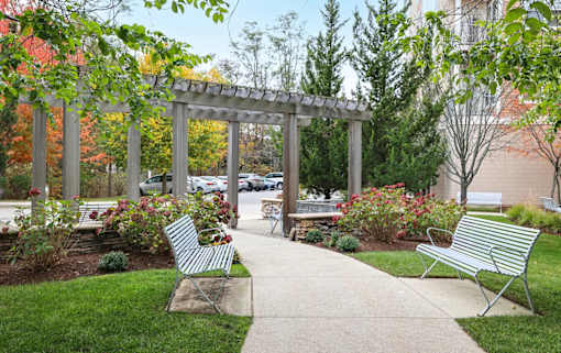 A park with benches and a walkway.