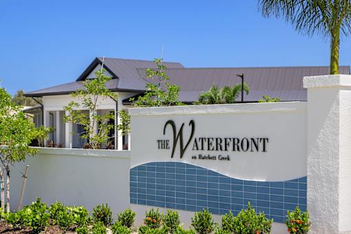 the water front sign in front of a house