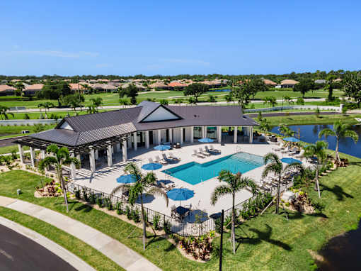 an aerial view of the pool and clubhouse at the resort at longboat key club