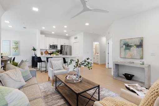 a living room with couches and chairs and a table