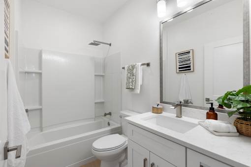 a bathroom with a sink toilet and a bath tub