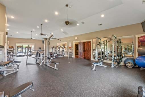 A spacious gym with a variety of equipment. at The Villas at Nature Walk, Huntsville, AL, 35824