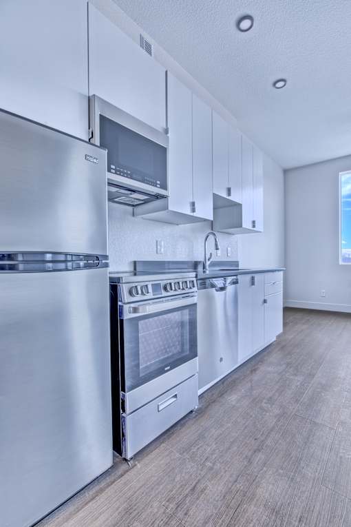 Kitchen with a Stove at Sloan's Place Apartments, Denver, CO