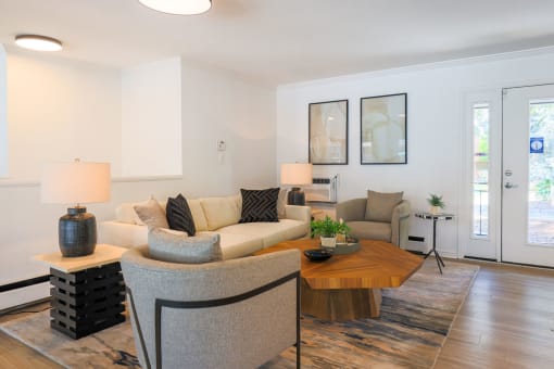 a living room with a couch and a table at The Wesley Apartments, Colorado, 80222