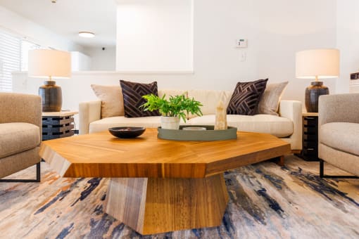 a living room with couches and a coffee table at The Wesley Apartments, Denver  