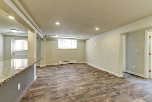 the living room and dining room of a new home