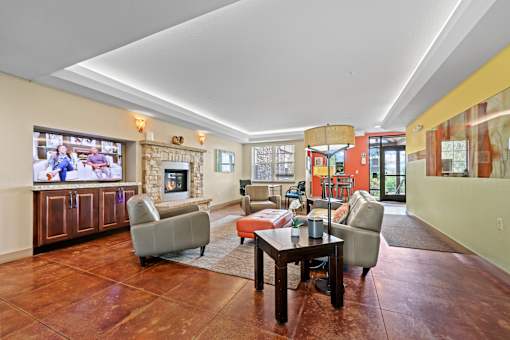 A living room with a fireplace and a television.