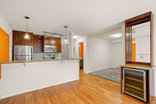 A kitchen with wooden cabinets and a white countertop.