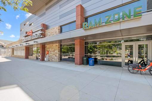 A Ram Zone storefront with a bicycle parked outside.