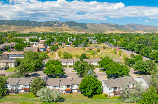 an aerial view of a neighborhood with houses and trees