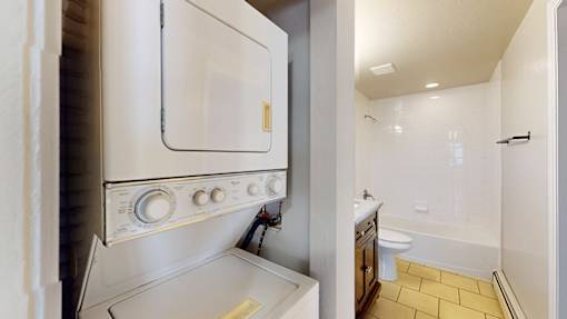 A white oven is built into a kitchen counter.