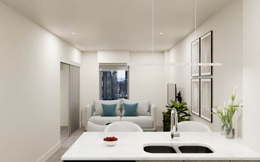 A modern kitchen with a white countertop and a large window.