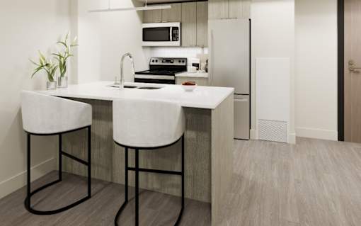 A kitchen with a white countertop and bar stools.