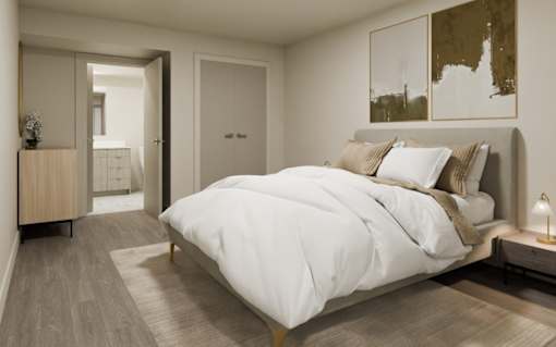 A bedroom with a large bed and a wooden dresser.