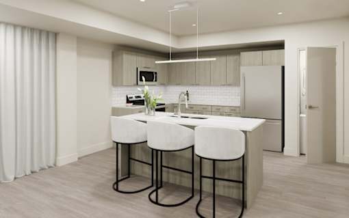 A modern kitchen with a bar stool and a countertop.