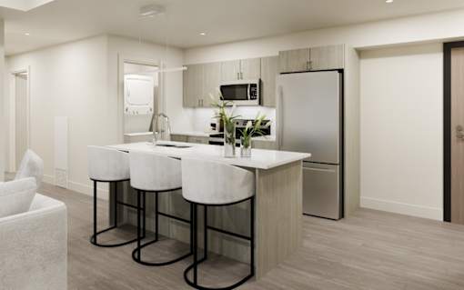 A modern kitchen with a white countertop and bar stools.
