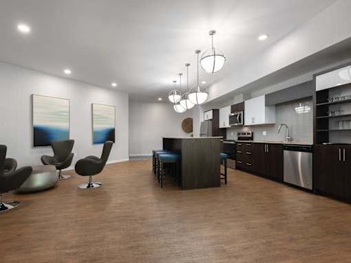 A modern kitchen with dark wood floors and a bar area.