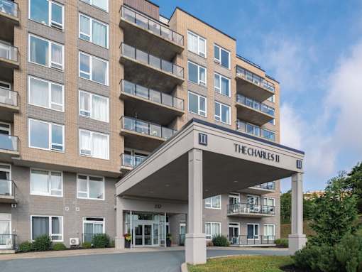 The Charles II apartment building has a covered entrance.