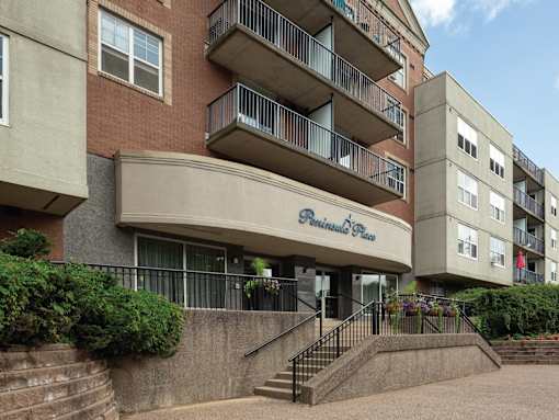 The entrance to a building with the words "Pinnacle Place" on it.