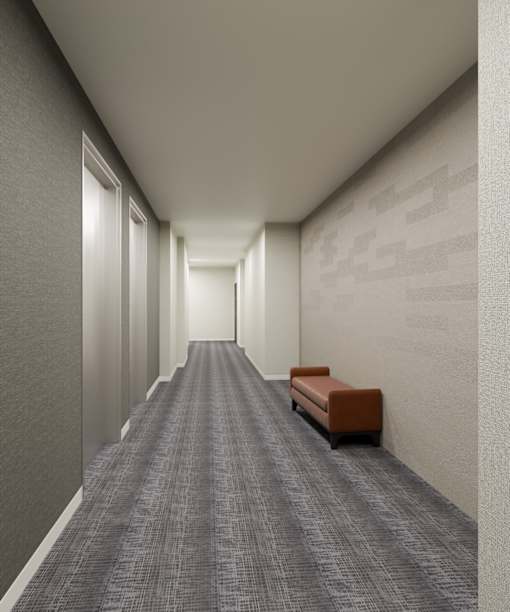 A long hallway with a bench on the right side.