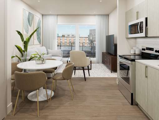 A modern kitchen with a dining table and chairs.