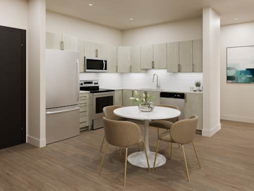 A modern kitchen with a table and chairs.